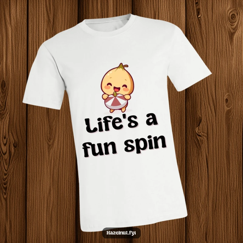 Funny Hazelnut T-Shirt featuring a cute hazelnut with a big smile holding a miniature spinning top, radiating pure delight.